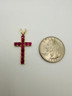 10k yellow gold ruby cross pendant featuring prong-set ruby gemstones in cross shape