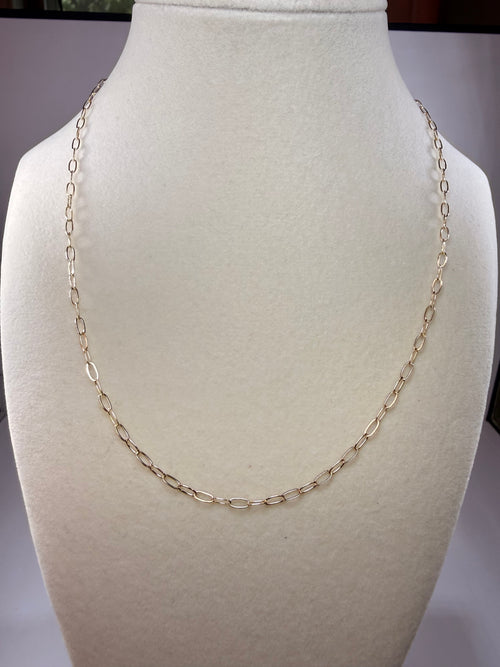10k yellow gold 18 inch paperclip chain necklace displayed on a mannequin
