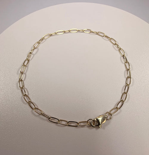 10k solid yellow gold 7 inch paperclip link chain bracelet with a lobster clasp, measuring 2.1mm in width