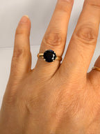14k yellow gold ring with round deep blue sapphire, slim band