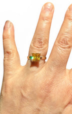14k yellow gold princess-cut yellow sapphire ring on finger, square yellow gemstone