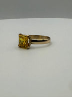 14k yellow gold princess-cut yellow sapphire ring, side view of square gemstone