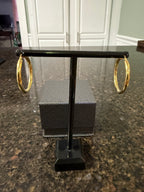 14k yellow gold round hoop earrings on display stand, hinged latch back