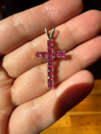 10k yellow gold ruby cross pendant with prong-set ruby gemstones and top bail loop