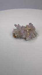 Gold diamond cross pendant centered on druzy crystal cluster